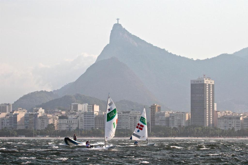 Laser Radials sailing under the statue of Christ the Redeemer - the day started as a flat calm and increased to over 25kts in a few minutes © Richard Gladwell www.photosport.co.nz